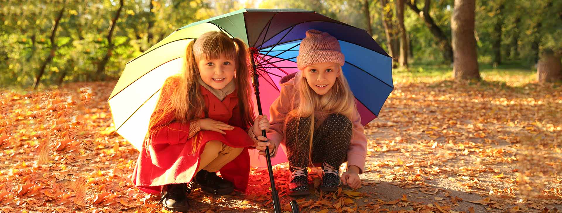 A child are holding an umbrella